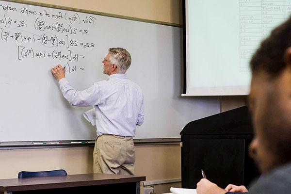 professor at white board