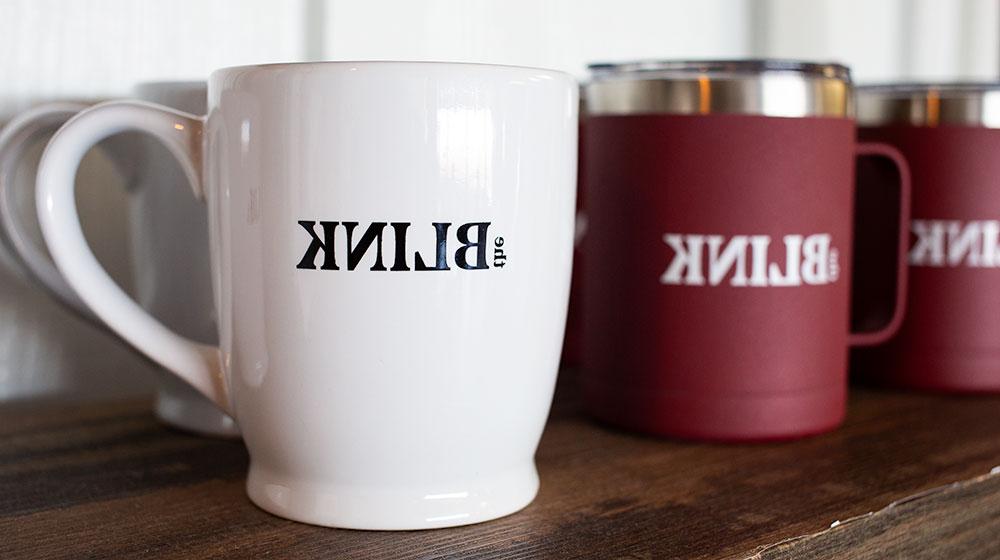 coffee mugs on wooden shelf